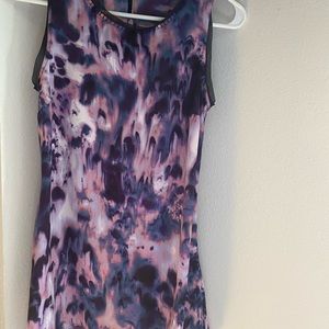 Short in the front and longer in the Back. Buttons in the back